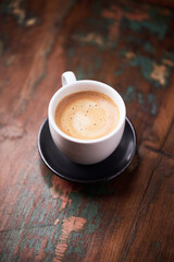 Cup of coffee on rustic wooden background. Copy space.	