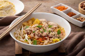 Tom Yum noodle soup ,Egg noodles with Minced Pork and meatball.popular hot and spicy soup in Thailand