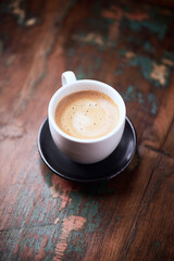 Cup of coffee on rustic wooden background. Copy space.	