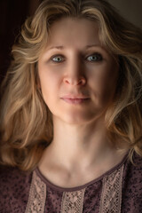 Close-up portrait of a beautiful fair-haired middle-aged woman.