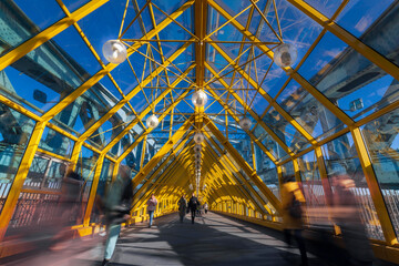 Interior of pedestrian bridge with sophisticated metal structures in contrast light, Moscow, Russia