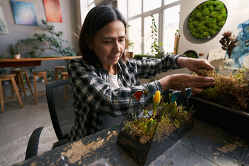 Portrait of smiling florist working in studio