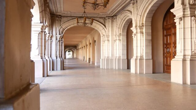 Spanish colonial revival architecture, Balboa Park, San Diego, California USA. Historic building, classic baroque or rococo romance style. Arches and columns of Casa, archway, vault, arcade or passage