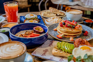 College of Breakfast Assortiment with pancakes, eggs, coffee 