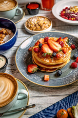 College of Breakfast Assortiment with pancakes, eggs, coffee 