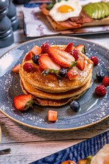 College of Breakfast Assortiment with pancakes, eggs, coffee 