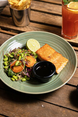 Assorted food set on table, Salmon with broccoli, salad, club sandwich, salad with quinoa, tartar from beef