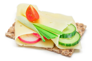 Whole Grain Crispbread with Cheese, Fresh Cucumber, Radish, Tomato and Green Onions - Isolated on...