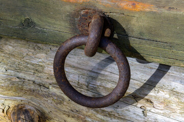 Rusty mooring on wooden pier