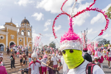 Close-up of an unrecognizable masked Latino man participating in a traditional holy week festivity...