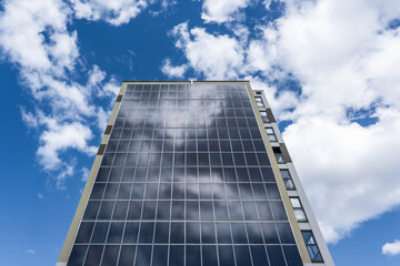 Fototapeta na wymiar solar panels on the wall of a multi-storey building. Renewable solar energy.