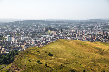 Fototapeta premium Scotland, Edinburgh. Holyrood park and ancient volcano. Beautiful panoramic view City of Edinburgh from the mountain