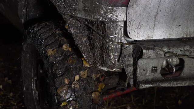 Close-up of a dirty car with a broken rear bumper. SUV in the fall. The car after the race. Rear light.