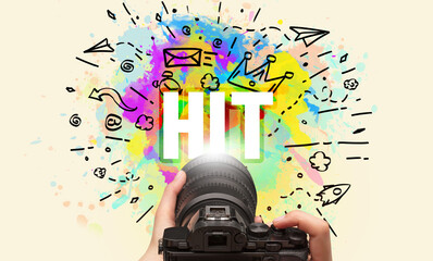 Close-up of a hand holding digital camera with abstract drawing