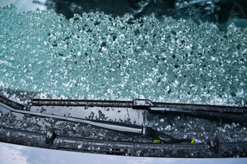 Texture of icy hail on ground. Ice Crystal Formation, pattern. Hailstones, hail on the hood and on the windshield of the car