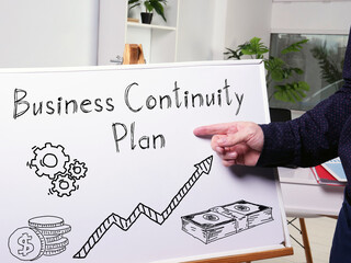 Business continuity plan is shown using the text on the board - obrazy, fototapety, plakaty
