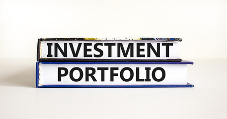 Investment portfolio symbol. Books with concept words Investment portfolio on beautiful white background. Business investment portfolio concept. Copy space.