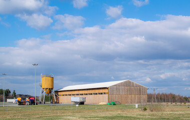 A big barn, hall, and silo on farms