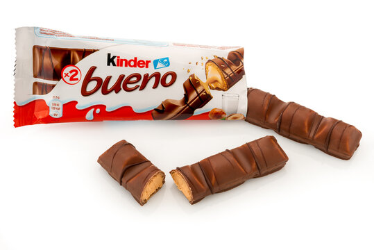 Alba, Italy - April 16, 2022: Kinder Bueno snack filled with hazelnuts with the crispness of a wafer sheet covered with chocolate, produced by Ferrero important confectionery factory in the world