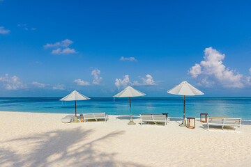 Beautiful tropical scenery, sun beds, loungers, umbrellas. White sand, sea view with horizon, calm relax. Carefree beach resort. Exotic travel destination, outdoor tourism background. Luxury landscape