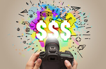 Close-up of a hand holding digital camera with abstract drawing concept
