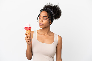Young african american woman with a cornet ice cream isolated on white background looking to the...