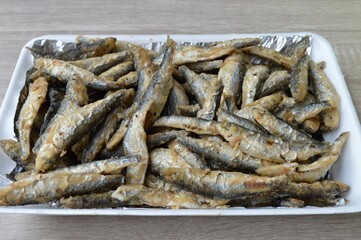 Fried fish Euroropean sprat or sardine, a small and tasty fish caught in the Irish Sea, the Black Sea, the Baltic Sea and the Sea of the Hebrides.