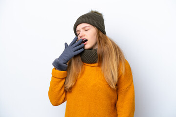 Teenager Russian girl wearing winter jacket isolated on white background yawning and covering wide...