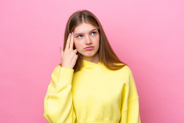 Teenager Russian girl isolated on pink background with problems making suicide gesture