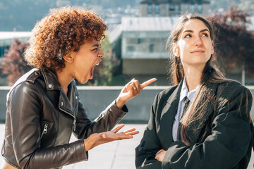 girls arguing and fighting on the street outdoors