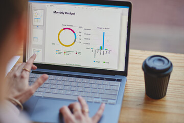 Making sure the data is perfect. High angle shot of an unrecognizable businesswoman working on a...