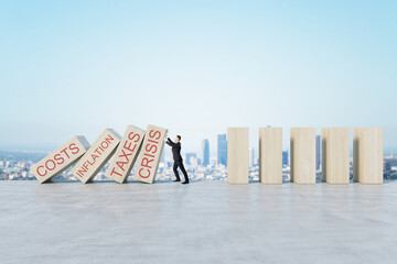 Businessman stopping abstract wooden domino blocks on bright sky background with mock up place....