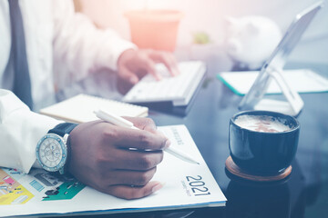 A businessman who works at home has a laptop computer. with morning coffee
