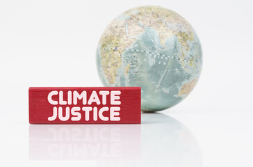 Near the globe is a red plaque with the inscription - Climate justice