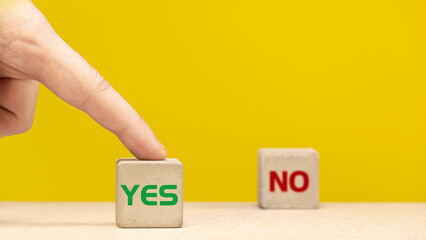 the inscription yes and no on concrete cubes. OK