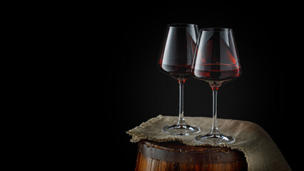 Still life with glasses of red wine on wooden background, copy space
