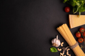 Pasta pesto. ingredients for Green vegetarian sauce pesto with basil, parmesan, nuts and olive oil. mediterranean traditional pasta