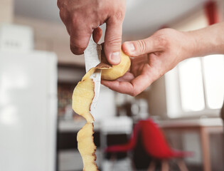  chef peeling potatoes