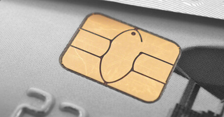 Fragments of a bank plastic card and banknote. Yellow integrated chip closeup. It is highlighted in color. The rest of the picture is black and white. Horizontal stories. Payment system Mir. Macro