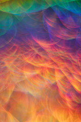 bright abstract iridescent background with bokeh holography