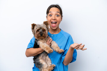 Young veterinarian woman with dog isolated on white background with shocked facial expression