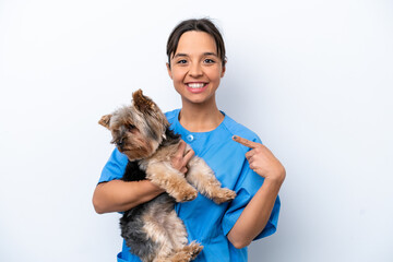 Young veterinarian woman with dog isolated on white background with surprise facial expression