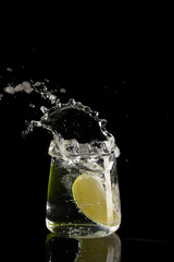Fototapeta na wymiar mojito cocktail on a black background with reflection