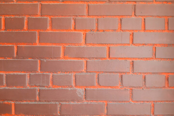 Obraz premium Brick wall background. Bright brown-orange.