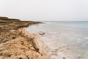 Landscape image of the Dead Sea in Israel during a cloudy day. 