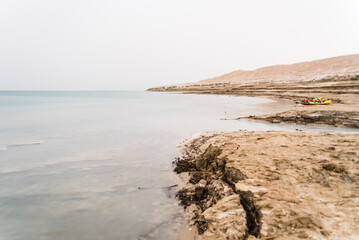 Landscape image of the Dead Sea in Israel during a cloudy day. 
