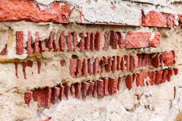 corrosion of the street wall. wet brick. rash plaster
