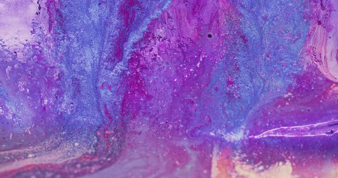 Paint mix. Wet ink texture. Marble pattern. Blur fluorescent purple pink blue color shiny fluid wave motion creative abstract background shot on RED Cinema camera.