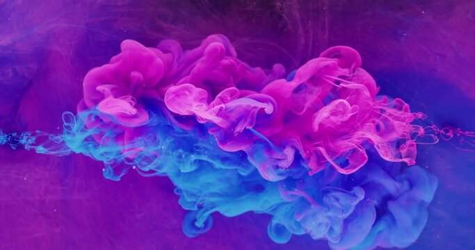 Color fluid mix. Smoke cloud motion. Logo opener effect. Neon pink blue ink drop on bright purple fog texture abstract background shot on Red Cinema camera 6k.