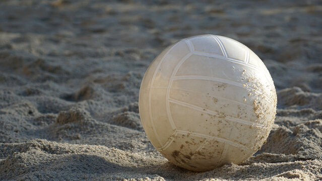 Beach Volleyball Sits In The Sand